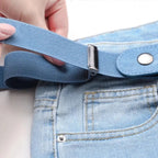 Close-up of the light blue belt band passing through its sliding adjuster