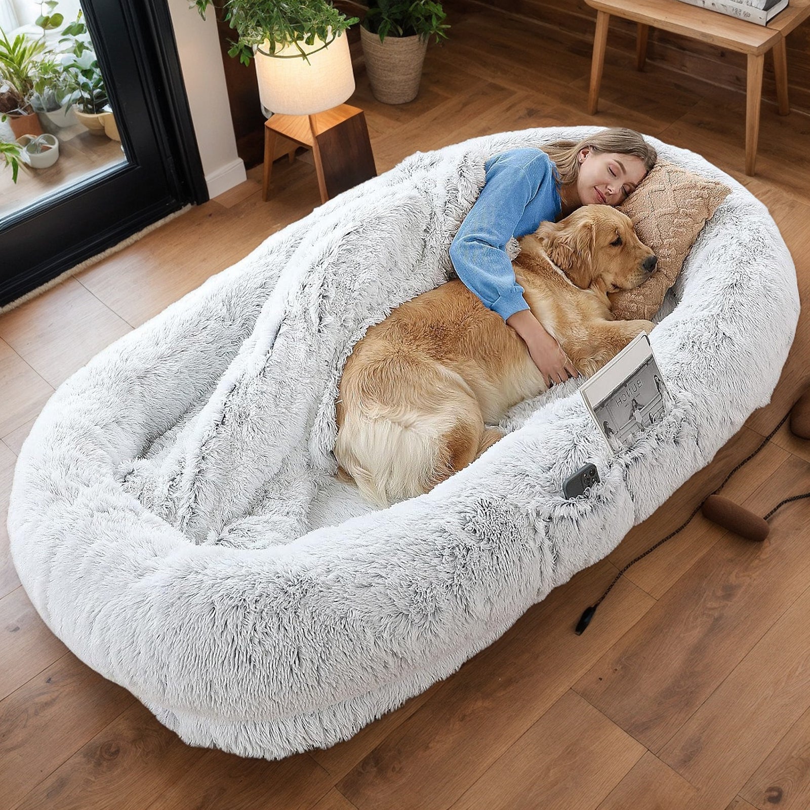 Human-size dog bed with owner and dog lounging together